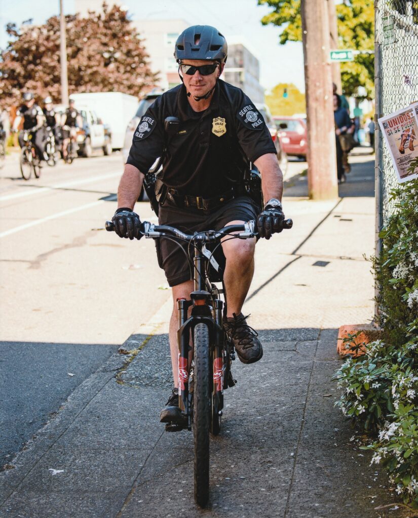 Keith Swank on bike patrol in police uniform